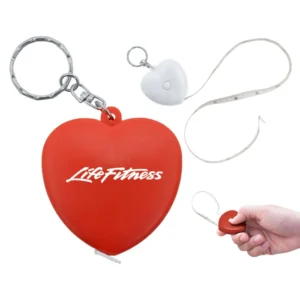 Llaveros de plástico personalizados en forma de corazón con cinta métrica como detalle promocional.
